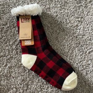 red/white fuzzy socks with grips on the bottom